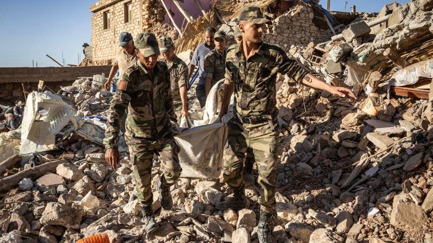 Moroccan Royal Armed Forces evacuate a body from a house destroyed in an earthquake in the mountain village of Tafeghaghte, southwest of the city of Marrakesh, on September 9, 2023.